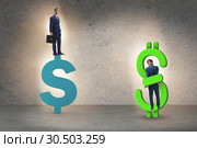Businessman in dollar and debt concept. Стоковое фото, фотограф Elnur / Фотобанк Лори