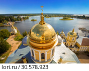 Panorama of the Nilo-Stolobensky monastery in the Tver region on the background of lake Seliger with the dome of the Epiphany Cathedral of the monastery. Tver region, Russia (2014 год). Стоковое фото, фотограф Наталья Волкова / Фотобанк Лори