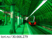 The "Lastochka" train arrives at the "Business center" station of the Moscow Central ring, Moscow, Russia (2016 год). Редакционное фото, фотограф Наталья Волкова / Фотобанк Лори