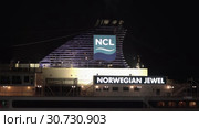 Night view of upper deck of Cruise Liner Norwegian Jewel with pipe spewing smoke (2019 год). Редакционное видео, видеограф А. А. Пирагис / Фотобанк Лори