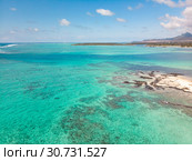 Aerial view of beautiful tropical beach with turquoise sea. Tropical vacation paradise destination of D'eau Douce and Ile aux Cerfs Mauritius. Стоковое фото, фотограф Matej Kastelic / Фотобанк Лори