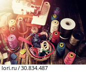 Sewing accessories group object sewing spool and serger top view. Стоковое фото, фотограф Gennadiy Poznyakov / Фотобанк Лори