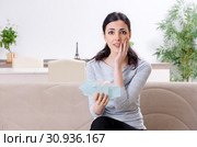 Young woman in budget planning concept. Стоковое фото, фотограф Elnur / Фотобанк Лори
