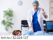 Female patient getting an injection in the clinic. Стоковое фото, фотограф Elnur / Фотобанк Лори