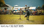 BULGAR, RUSSIA 11-08-2019: Knight riding a horse on the field - holding a spear. Редакционное видео, видеограф Константин Шишкин / Фотобанк Лори