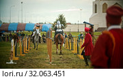 BULGAR, RUSSIA 11-08-2019: Knights having a battle on the field - running on each other and breaking the plastic spear - assistens watching them. Редакционное видео, видеограф Константин Шишкин / Фотобанк Лори