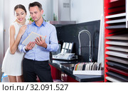 Married couple looking for stylish kitchen fronts. Стоковое фото, фотограф Яков Филимонов / Фотобанк Лори