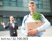 Serious man is standing upset near office. Стоковое фото, фотограф Яков Филимонов / Фотобанк Лори