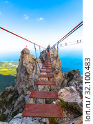 Ai-Petri, Crimea - July 5, 2019. Suspension bridge on top of the mountain. Редакционное фото, фотограф Володина Ольга / Фотобанк Лори
