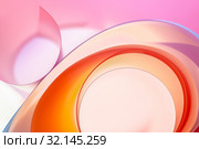 The background photo is colored rounded plates in close-up. Стоковое фото, фотограф Olesya Tseytlin / Фотобанк Лори