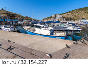 Sevastopol, Crimea - July 3. 2019. Boat in the Balaklava Bay. Редакционное фото, фотограф Володина Ольга / Фотобанк Лори