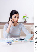 Young woman in budget planning concept. Стоковое фото, фотограф Elnur / Фотобанк Лори