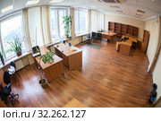 Vacant office space with leave furniture after leasholder moving, no people, wide angle view. Стоковое фото, фотограф Кекяляйнен Андрей / Фотобанк Лори