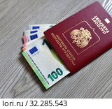 Russian foreign passport and an euro bills. Стоковое фото, фотограф Володина Ольга / Фотобанк Лори