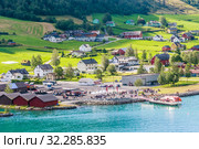 Small  houses at Olden, Norway.Olden is a village and urban area in the municipality of Stryn in Sogn og Fjordane county, Norway. Редакционное фото, фотограф Николай Коржов / Фотобанк Лори
