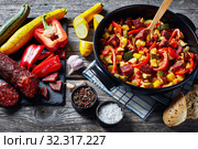 hot Pisto manchego in a black pan. Стоковое фото, фотограф Oksana Zh / Фотобанк Лори
