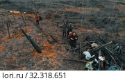 19-10-2019 RUSSIA, REPUBLIC OF TATARSTAN: People standing on the scorched ground. Редакционное видео, видеограф Константин Шишкин / Фотобанк Лори