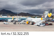 Aircraft by Thomas Cook is on aerodrome. Thomas Cook Airlines Ltd served leisure destinations worldwide. Sofia Reina, Canary, Tenerife (2016 год). Редакционное фото, фотограф Кекяляйнен Андрей / Фотобанк Лори