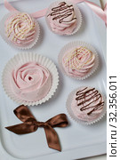 Aerial pink cherry marshmallows. Different shapes and sizes. Sprinkled with dextrose. Garnished with Chocolate. Стоковое фото, фотограф Vadzim Yakubovich / Фотобанк Лори