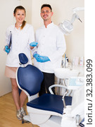 Stomatologist in uniform with assistent are meeting next client by the chair. Стоковое фото, фотограф Яков Филимонов / Фотобанк Лори