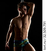Male pole dance. Photo of muscular man posing. Стоковое фото, фотограф Гурьянов Андрей / Фотобанк Лори