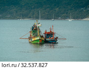Fishing boat Engine on the beach in Asian tropical sea. Стоковое фото, фотограф Aleksejs Bergmanis / Фотобанк Лори