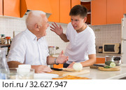 Teenage boy friendly talking to grandfather. Стоковое фото, фотограф Яков Филимонов / Фотобанк Лори