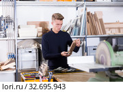 Young architect making architectural model. Стоковое фото, фотограф Яков Филимонов / Фотобанк Лори