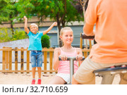 Company of kids are teetering on the swing. Стоковое фото, фотограф Яков Филимонов / Фотобанк Лори