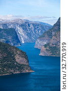 Aurlandsfjord is the 29-kilometre (18 mi) long fjord in Sogn og Fjordane county. Norway. Seen north-northwest from Stegastein (2018 год). Стоковое фото, фотограф Кекяляйнен Андрей / Фотобанк Лори