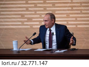 Президент Российской Федерации Владимир Владимирович Путин говорит во время большой ежегодной пресс-конференции в Центре международной торговли на Красной Пресне в центре города Москвы, Россия 19 декабря 2019. Редакционное фото, фотограф Николай Винокуров / Фотобанк Лори
