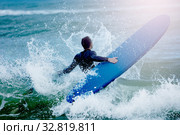 Man concur sea waves hold surf board water splash. Стоковое фото, фотограф Сергей Новиков / Фотобанк Лори