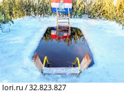 A large ice hole with stairs is ready for swimming walruses. text in Russian: Samara (2019 год). Стоковое фото, фотограф Акиньшин Владимир / Фотобанк Лори