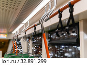 Interior elements of public transport on a blurred background. Стоковое фото, фотограф Евгений Харитонов / Фотобанк Лори