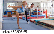 Man and woman doing exercises on floor. Стоковое фото, фотограф Яков Филимонов / Фотобанк Лори