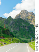 Vertical photo of the Caucasus landscape, view of the mountains and the road. Стоковое фото, фотограф Константин Лабунский / Фотобанк Лори
