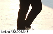 A young blonde woman spinning around herself on ice rink. Стоковое видео, видеограф Константин Шишкин / Фотобанк Лори