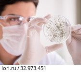 Male doctor working in the lab on virus vaccine. Стоковое фото, фотограф Elnur / Фотобанк Лори