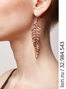 Beautiful woman with galvanic earring in form of fern leaf. Стоковое фото, фотограф Сергей Пристяжнюк (Serg Zastavkin) / Фотобанк Лори