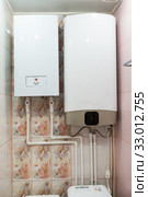 Independent heat-recovery boiler with hot water tank, domestic heating system. Стоковое фото, фотограф Кекяляйнен Андрей / Фотобанк Лори