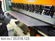 hydraulic press brake or bending machine for flat sheet metal. Стоковое фото, фотограф Дмитрий Калиновский / Фотобанк Лори