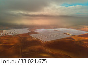 Aerial image drone point of view photo Gemasolar Concentrated solar power plant CSP, system generate solar power using mirrors lenses to concentrate large area of sunlight onto receiver, Seville Spain. Стоковое фото, фотограф Alexander Tihonovs / Фотобанк Лори