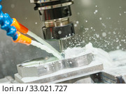 Milling process. Industrial CNC metal machining by vertical mill. Coolant. Стоковое фото, фотограф Дмитрий Калиновский / Фотобанк Лори