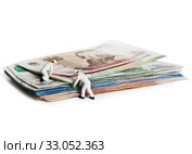 Doll people with Russian paper bills. Isolated on a white background. Стоковое фото, фотограф Элина Гаревская / Фотобанк Лори