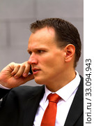 Young businessman talking in the cellphone. Стоковое фото, фотограф Arpad Radoczy / PantherMedia / Фотобанк Лори