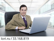 young businessman working with is laptop at the office. Стоковое фото, фотограф Rui Vale de Sousa / Smarterpix / Фотобанк Лори