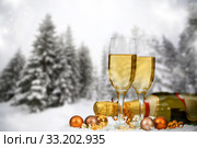 Christmas decorations and champagne against winter background. Стоковое фото, фотограф Erika Eros / Smarterpix / Фотобанк Лори