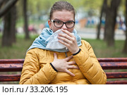 Молодая женщина с носовым платком на улице. Стоковое фото, фотограф Victoria Demidova / Фотобанк Лори