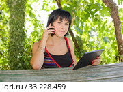 woman with tablet. Стоковое фото, фотограф Rui Vale de Sousa / Smarterpix / Фотобанк Лори