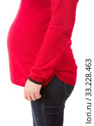 Closeup of pregnant woman at white background. Стоковое фото, фотограф Rui Vale de Sousa / Smarterpix / Фотобанк Лори